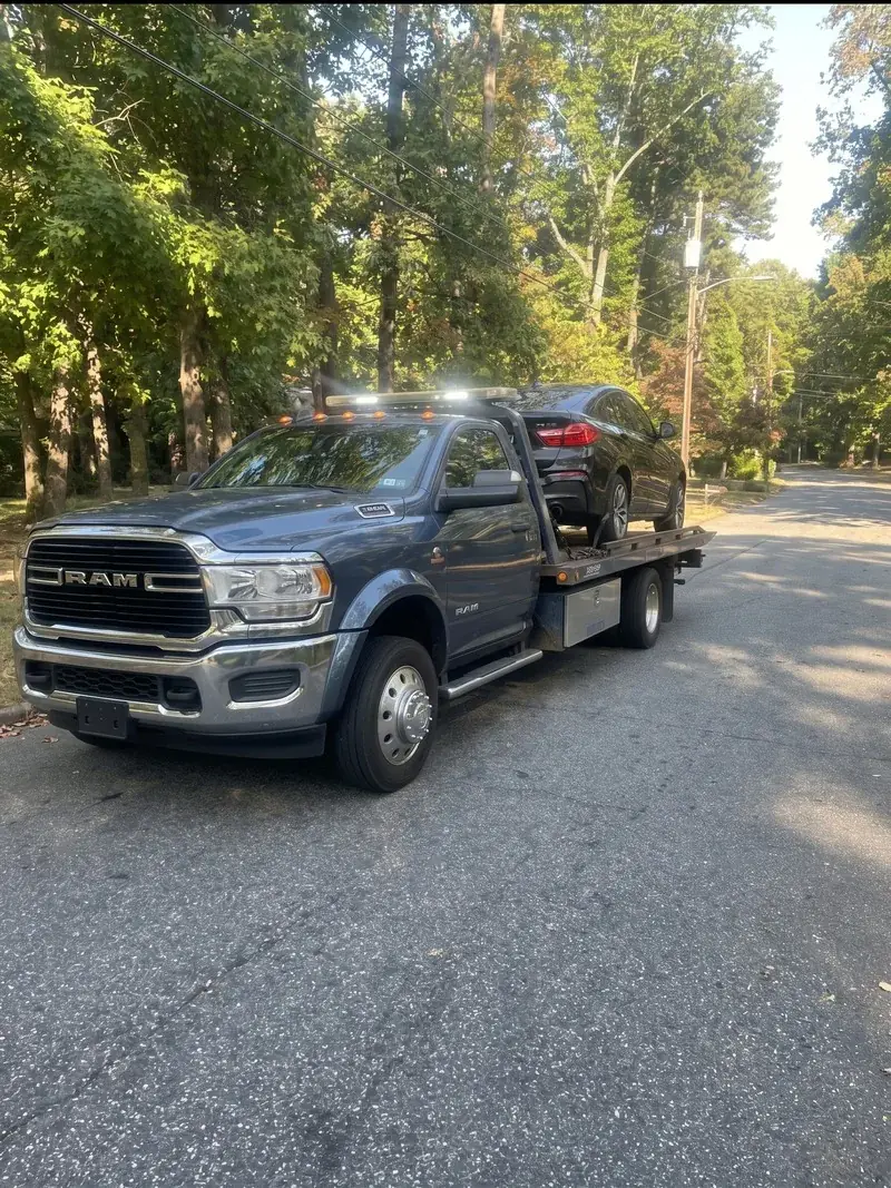 Tow truck towing a car on I-285 in Atlanta